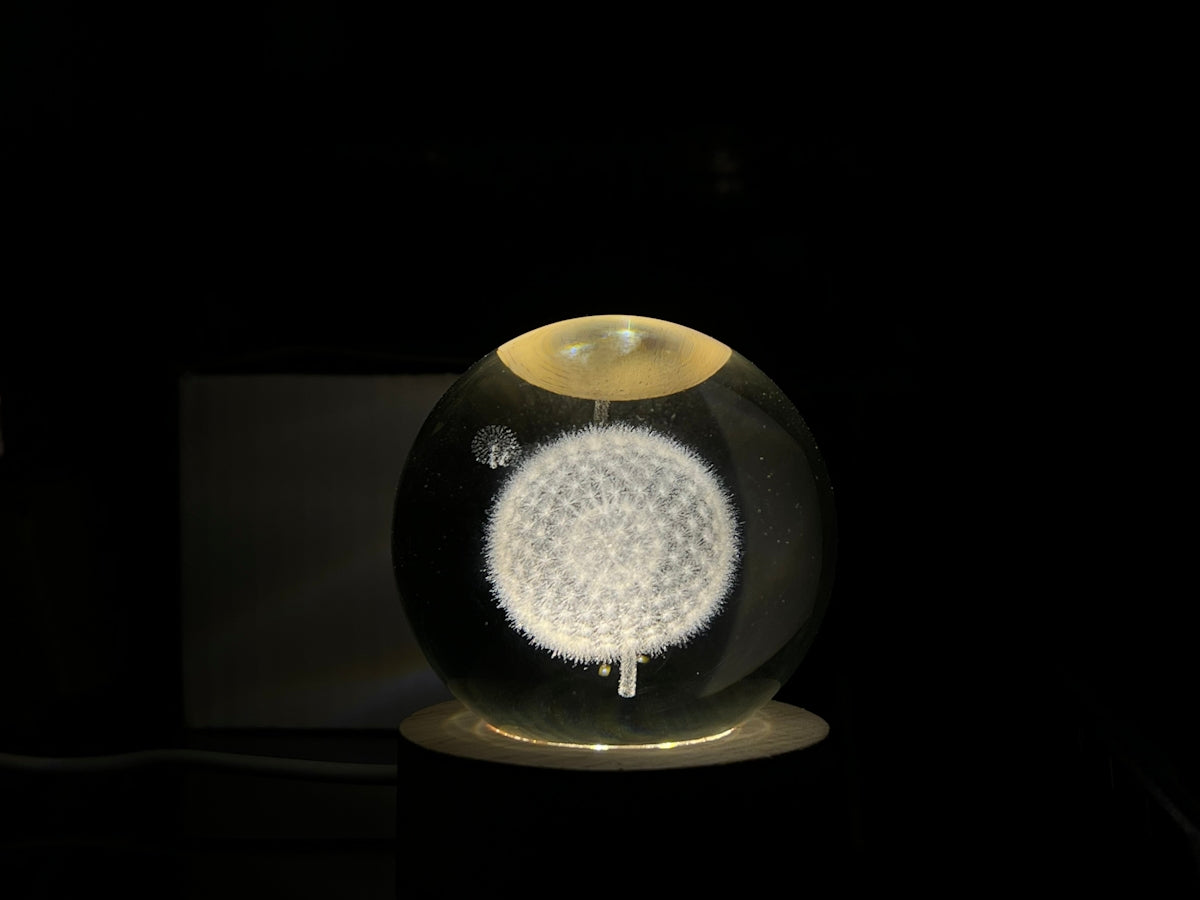 a glass ball with a white flower inside of it